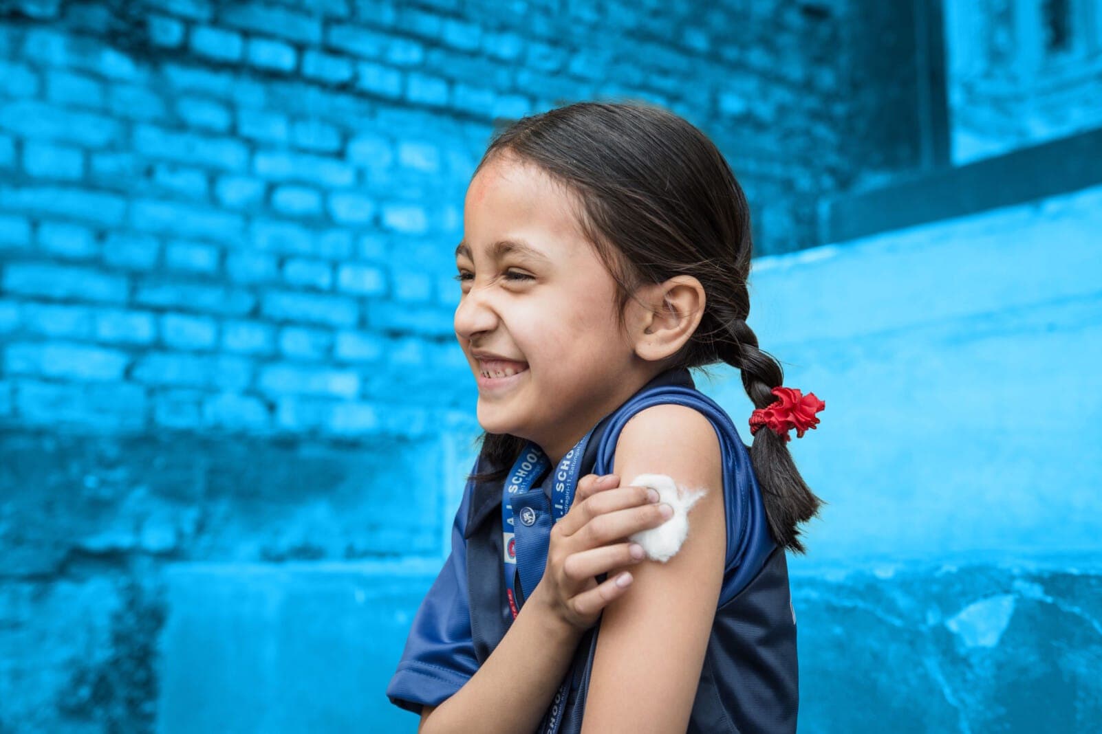 Smiling boy wearing a blue shirt